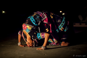 Close-up: Gypsy woman performing a Backbend, Manvar Desert Camp, Dechu, India