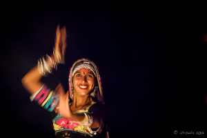 Abstract portrait: Kalbelia Dancers in ornate gypsy dresses and musician, Manvar Desert Camp, Dechu, India