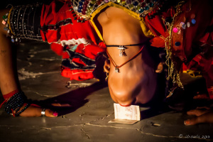 Close-up: Gypsy woman performing a Backbend, Manvar Desert Camp, Dechu, India