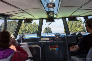 View of Clayoquot Sound waters from inside a motor boat, BC