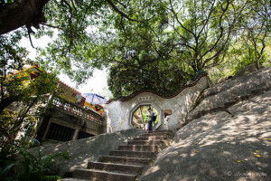 Arched gateway at the top of a steep stairway, Nan Putuo Temple, Xiamen, Fujian Province, China
