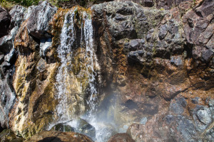 Hot mineralised water cascading over rock, Hot Springs Cove, Maquinna Marine Provincial Park BC