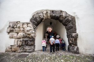 Tourists looking into Porta Praetoria, Regensburg DR