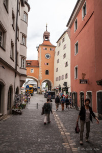 Cobbled streets leading to a Clock Tower, Regensburg Germany