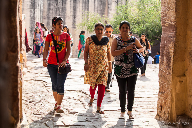 Three back-light Indian women entering Mehrangarh Fort, Jodhpur India