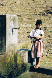 Nepalese Girl at a communal tap, Annapurnas