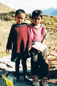 Two Nepalese children ion ragged clothing, Annapurnas
