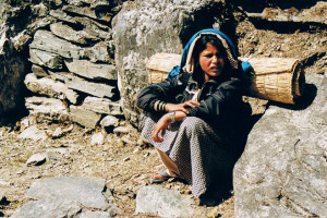 Young Nepalese girl with a bedroll, Annapurnas