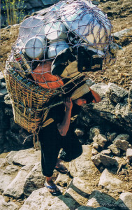 Loaded Nepalese Porter, the Annapurnas, Nepal