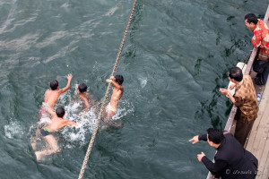 Batak boys diving from a ferry line, Lake Toba, Samosir Island, North Sumatra