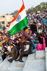 Man running with an Indian flag, Wagah Border, Amritsar Punjab India