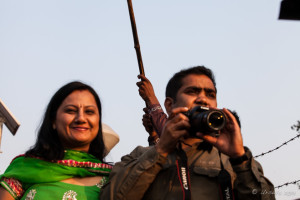 Smiling Indian woman, man with camera, Attari-Wagah Border, Amritsar Punjab India