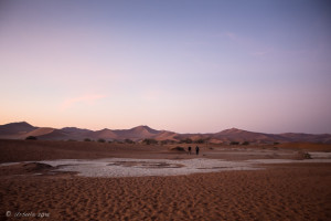 People walking out of Deadvlei in twilight, , Namib-Naukluft Park, Namibia