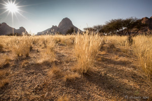 Sunflare over Spitzkoppe, Namib Desert, Namibia