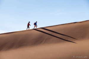 Two climbers on the ridge of a dunes, Deadvlei, Namib-Naukluft Park, Namibia