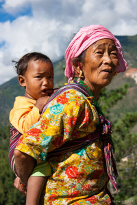 Bhutanese Grandmother and baby on the Ridge, Thimphu River, Bhutan