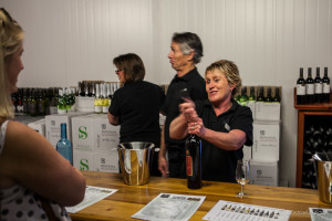 McGuigan rep pouring wine, McGuigan Cellar Door, Pokolbin AU