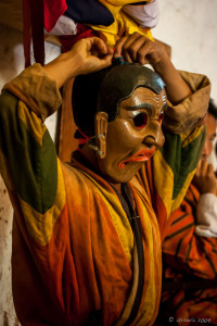 Cham dancer getting dressed, Wangduephodrang Dzongkhag Dzong, Central Bhutan.
