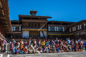 Crowd sitting inside Wangduephodrang Temple,