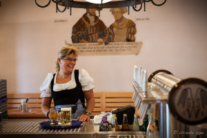 A Bavarian woman with a tray of beer inside the Schneider Brewery, Kelheim