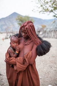 A Himba woman with a baby, Otjomazeva Village, Kunene Namibia
