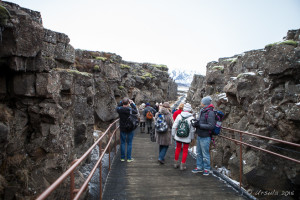People on a wooden a walkway into the Continental Divide, Thingvellir National Park, Iceland