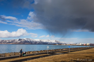 Man pushing a Baby carriage, Sæbraut, Reykjavik