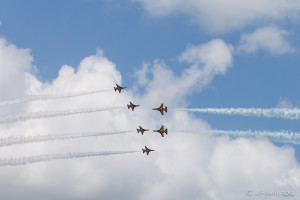 Six Black Eagles' KAI T-50B “Golden Eagle” jets flying towards each other, Singapore Airshow 2016