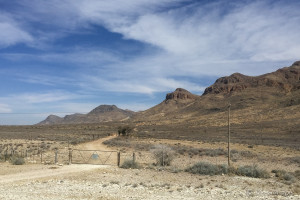 Fence across a gravel road, Namibia