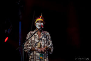 Indigenous Aboriginal man in white face paint, Arakwal Opening Ceremony, Byron Bay Bluesfest 2016