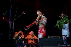 Indigenous Aboriginal man in white face paint, Arakwal Opening Ceremony, Byron Bay Bluesfest 2016