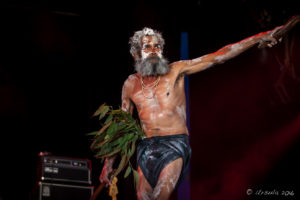 Indigenous Aboriginal man in white face paint, Arakwal Opening Ceremony, Byron Bay Bluesfest 2016