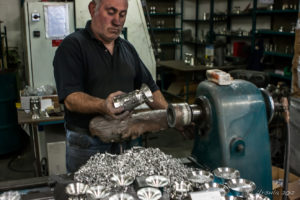 A man polishing pewter goblets, Mullingar Bronze and Pewter, Co. Westmeath, Ireland