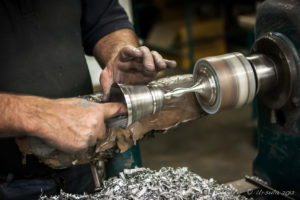 A man polishing pewter goblets, Mullingar Bronze and Pewter, Co. Westmeath, Ireland