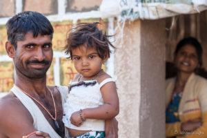 Rajasthani Man holding a Child, Thar Desert village, India