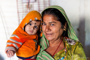 Woman in Green with Child