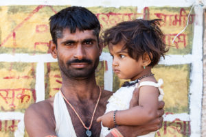 Rajasthani Man holding a Child, Thar Desert village, India
