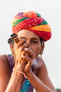Rajasthani man in a turban with a pipe, Khiyasariya village, India