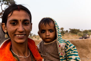 Rajasthani woman with a child in kohl, Khiyasariya village, India