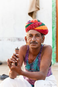 Rajasthani man in a turban with a pipe, Khiyasariya village, India
