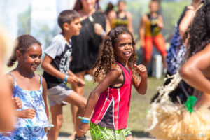 Young girls dancing in a crowd , Boomerang, Byron Bay Bluesfest 2016 AU