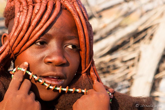 Close-up: pre-pubescent Himba girl with Beads, Kunene, Namibia
