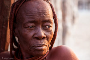 Portrait: old Himba woman, Otjomazeva Village, Kunene Namibia