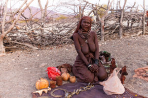 Old Himba Woman in a leather headscarf, with Trinkets, Otjomazeva Village, Kunene Namibia