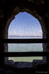 View over Lake Trasimeno from a Castello del Leone window, Italy