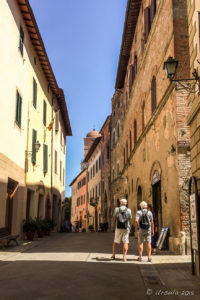 Tourists on a narrow Chiusi Street, Tuscany Italy