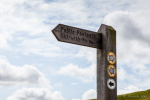 Public footpath signpost, Ingleton Waterfalls Trail, North Yorkshire, UK