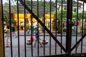 View from the Sa Huynh Culture Museum through a metal fence to the Street, Hoi An Vietnam