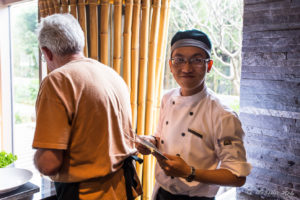 Smiling Vietnamese man in chef uniform, Hay Hay Restaurant Display Kitchen, Naman Retreat Danang Vietnam
