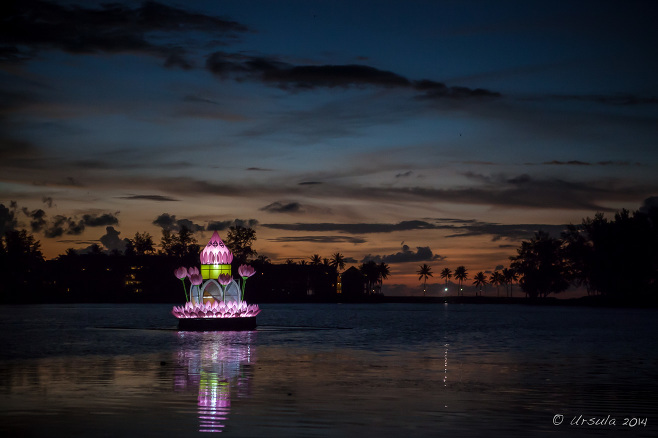 An over-sized pink plastic krathong in the middle of Laguna Lake, Phuket